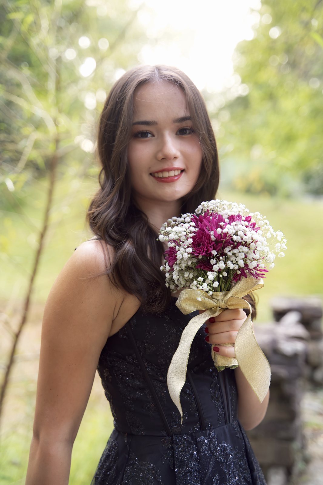 A homecoming portrait with a bouquet