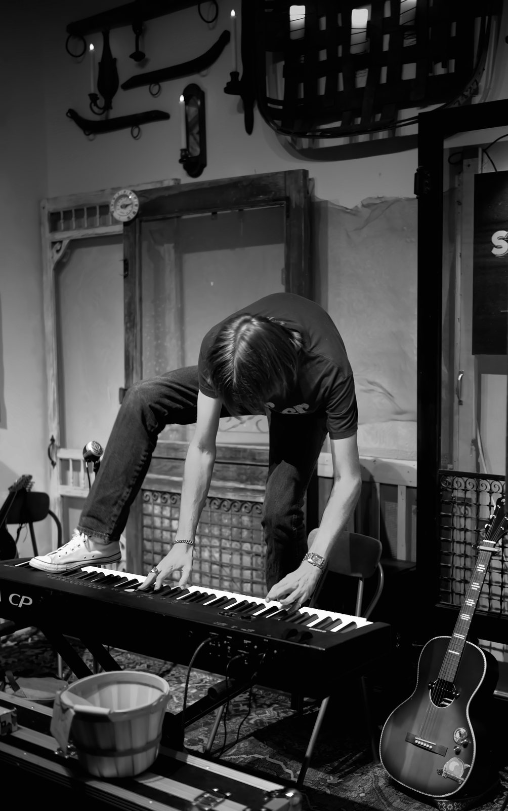 Jack Fishback leaning into the keyboard, in black and white