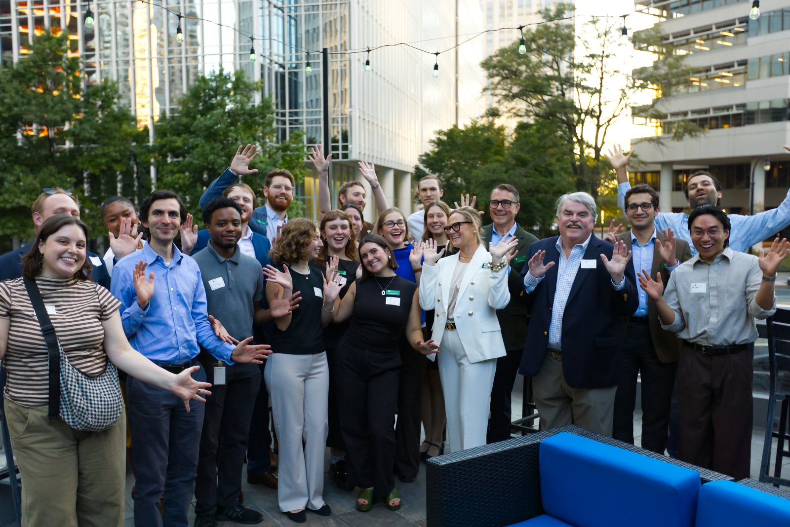 KB Advisory Group's team and guests celebrating 25 years on a rooftop
