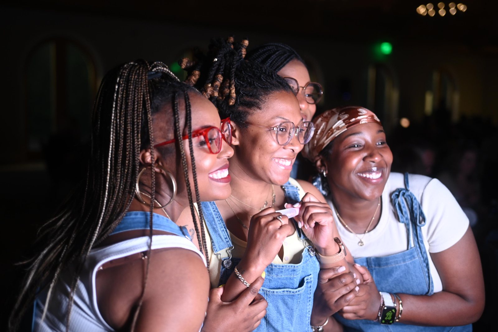 Guests laughing in the photo booth at the Habitat for Humanity Overall Ball