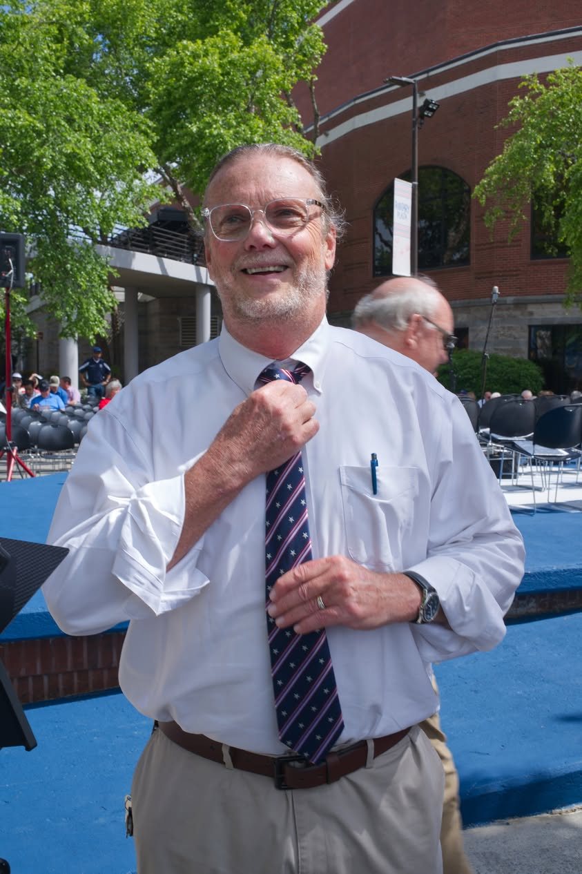 The director straightening his tie before the show